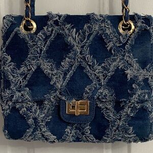 Luxurious Blue Shoulder Bag with Gold Hardware